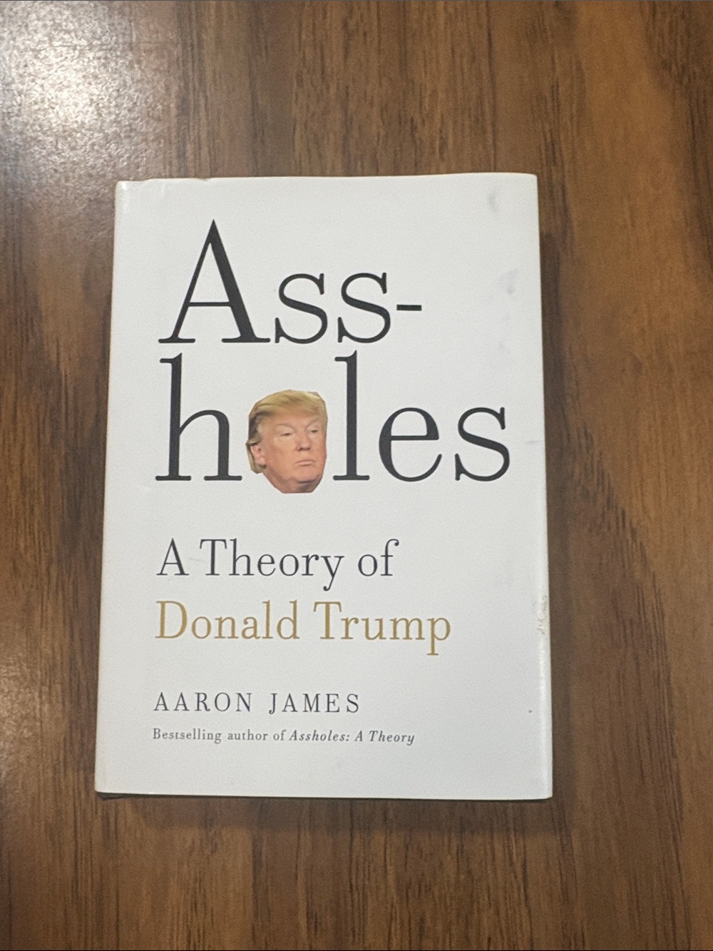 White Hardcover Book - "Assholes Theory of Donald Trump" first edition .